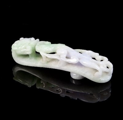 Lot 188 - A lavender jade belt hook, carved with a kylin...