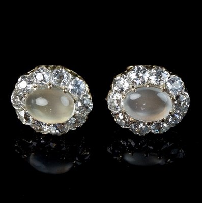 Lot 225 - A pair of moonstone and diamond cluster ear...