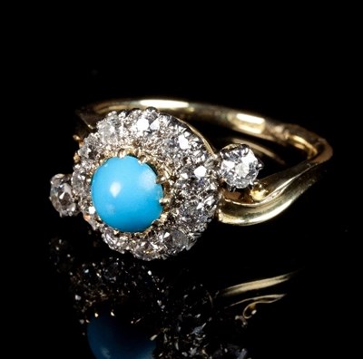 Lot 229 - A turquoise and diamond cluster ring in a...