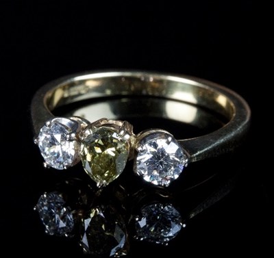 Lot 230 - A chameleon diamond and diamond three-stone...