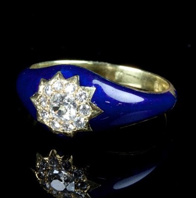 Lot 232 - A diamond and enamel ring, the cushion shaped...