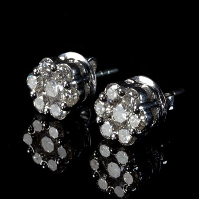 Lot 234 - A pair of diamond cluster ear studs, each...