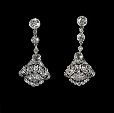 Lot 235 - A pair of diamond ear pendants, each with a...