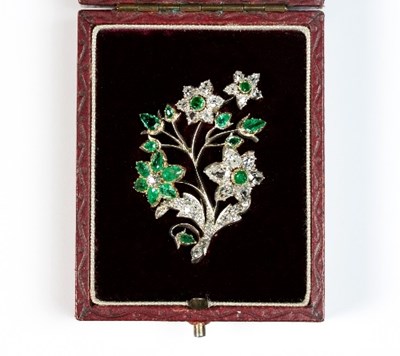 Lot 237 - A diamond and emerald flower spray brooch, 5cm...