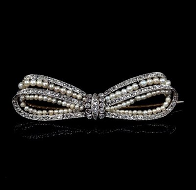 Lot 241 - A diamond and seed pearl bow brooch, adapted,...