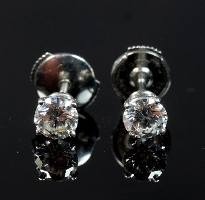 Lot 245 - A pair of diamond ear studs, by David Morris,...