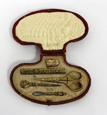 Lot 271 - A gold sewing set in a fitted scallop shell...