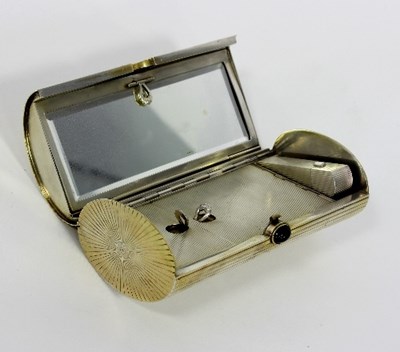 Lot 275 - A silver vanity case, of reeded oval form with...