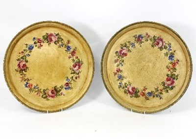 Lot 310 - Two circular metal trays decorated floral...