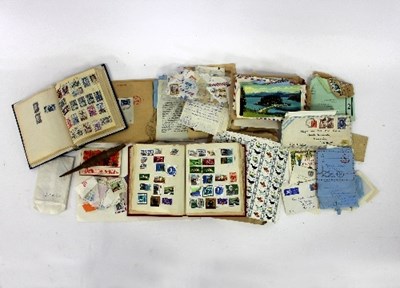 Lot 317 - A collection of stamps, two albums and loose,...