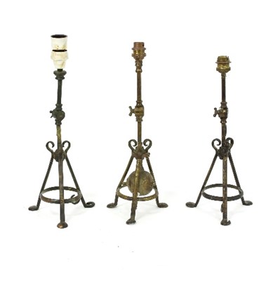 Lot 318 - Three burnished steel table lights of Arts and...