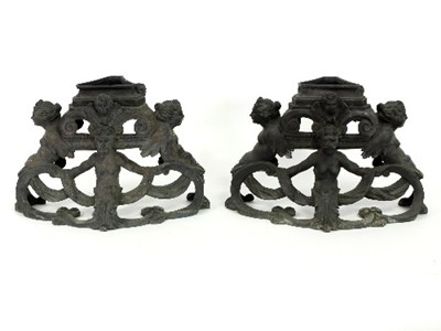 Lot 329 - Two cast iron bases, possibly for fire dogs,...