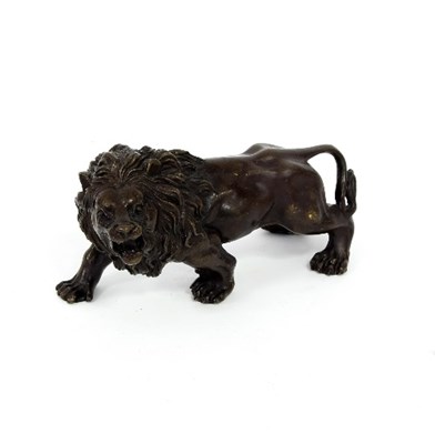 Lot 360 - A bronze figure of a lion, 15cm long