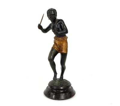 Lot 362 - A spelter figure of a tribesman holding a...