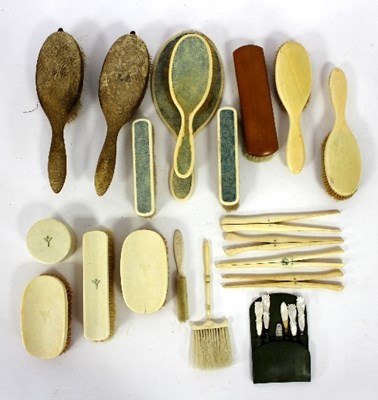 Lot 382 - A large quantity of ivory-backed hairbrushes,...