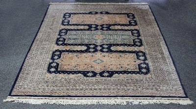 Lot 400 - A modern Eastern rug with three central panels...