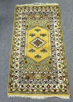 Lot 401 - A modern Eastern rug, with central yellow...