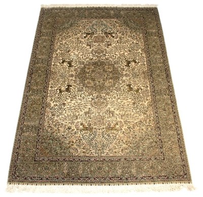 Lot 404 - A Qum silk rug decorated a central medallion...