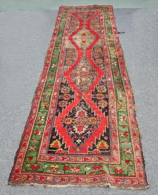 Lot 405 - An Eastern Turkomen runner, of geometric red...