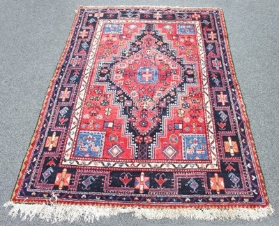 Lot 406 - A Hamadan rug with central red ground of...