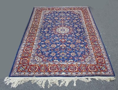 Lot 413 - A Tabriz carpet with floral blue ground...