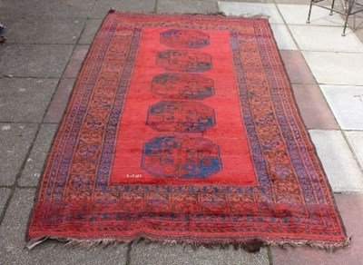 Lot 416 - An Afghan rug with five elephant foot...