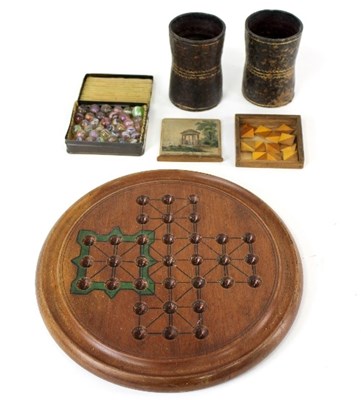 Lot 433 - A solitaire board and the marbles for the same,...