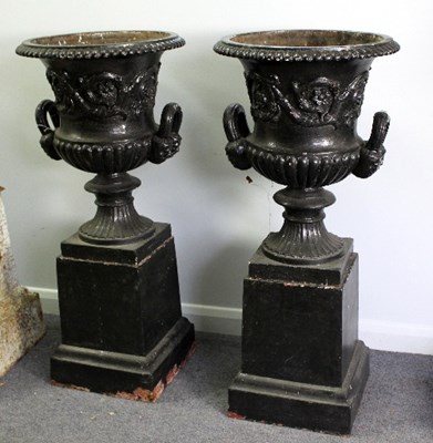 Lot 454 - A pair of black painted cast iron two-handled...