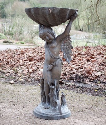 Lot 463 - A bronzed metal garden fountain modelled as a...