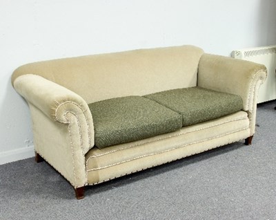 Lot 474 - An upholstered two-seater sofa on square...