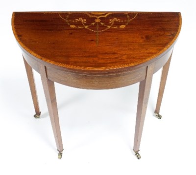 Lot 481 - A George III mahogany inlaid card table on...