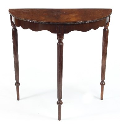 Lot 486 - A Mahogany half-round table, with shaped apron...