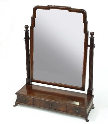 Lot 489 - A mahogany swing mirror on a three-drawer box...