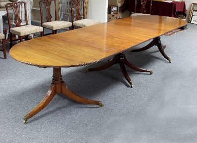 Lot 498 - A mahogany extending dining table, the two D...