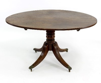 Lot 518 - A mahogany tilt-top breakfast table on turned...