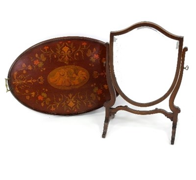 Lot 523 - A mahogany shield shape swing mirror, 42cm...