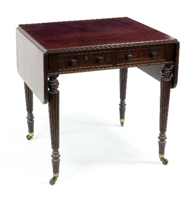 Lot 525 - A mahogany two-flap table with two drawers to...