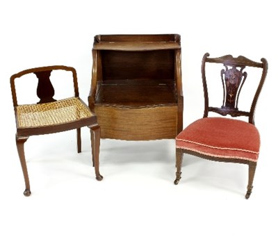 Lot 527 - A mahogany inlaid nursing chair with pierced...