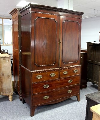 Lot 529 - An early 19th Century mahogany linen press,...