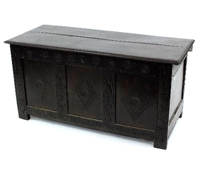 Lot 532 - A carved oak coffer with hinged top, 120cm wide