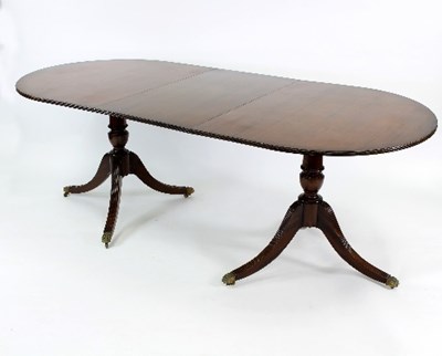 Lot 536 - A mahogany extending table on twin pedestal...