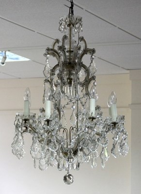 Lot 542 - A cut glass eight-light chandelier hung with...