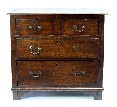 Lot 546 - An oak chest fitted two short over two long...