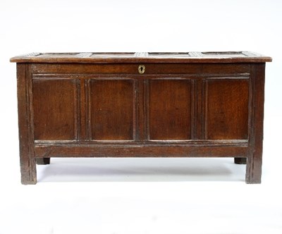 Lot 549 - A large oak chest with quadruple plank hinged...