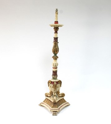 Lot 555 - An Italian altar-type candlestick on a flat...