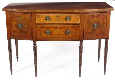 Lot 569 - A mahogany bowfront sideboard of Regency...