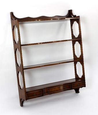 Lot 572 - A set of mahogany hanging shelves of...