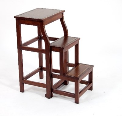 Lot 573 - A mahogany library stool, the top and step...