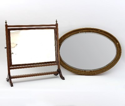 Lot 580 - An Edwardian mahogany swing frame mirror,...