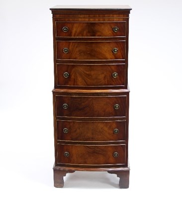 Lot 582 - A mahogany bowfront tallboy chest, fitted six...